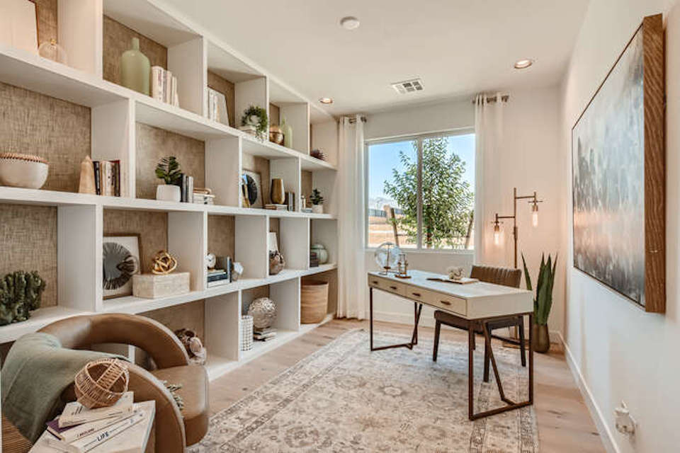A room with a table and shelves.