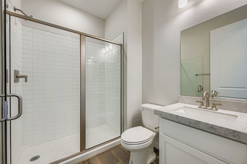 A bathroom with a glass shower.