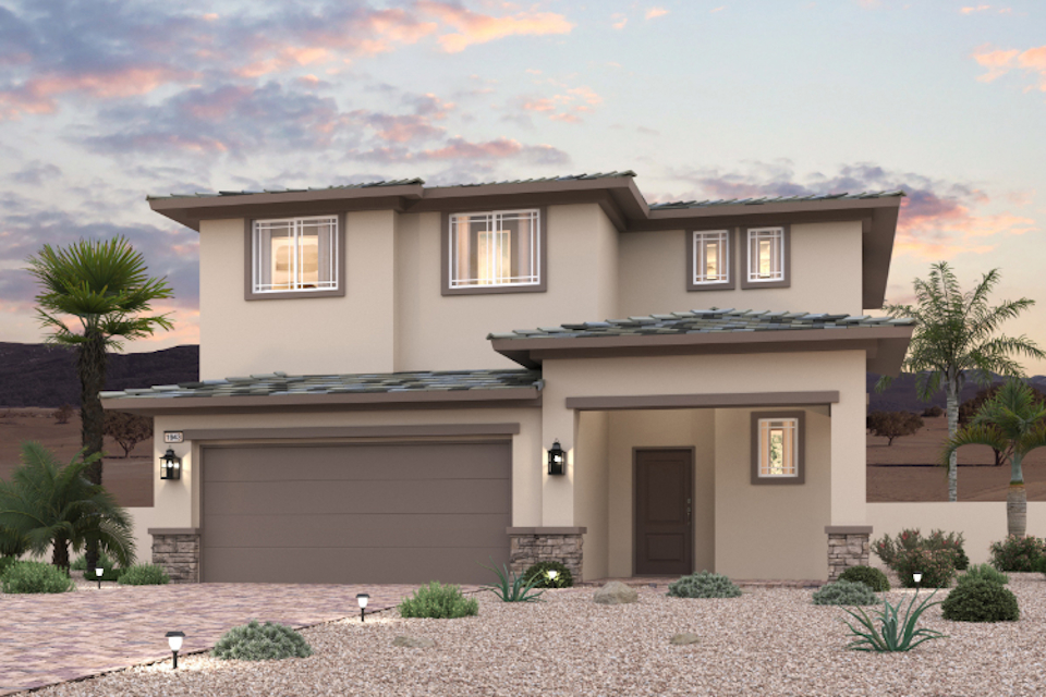 A house with a garage and palm trees.