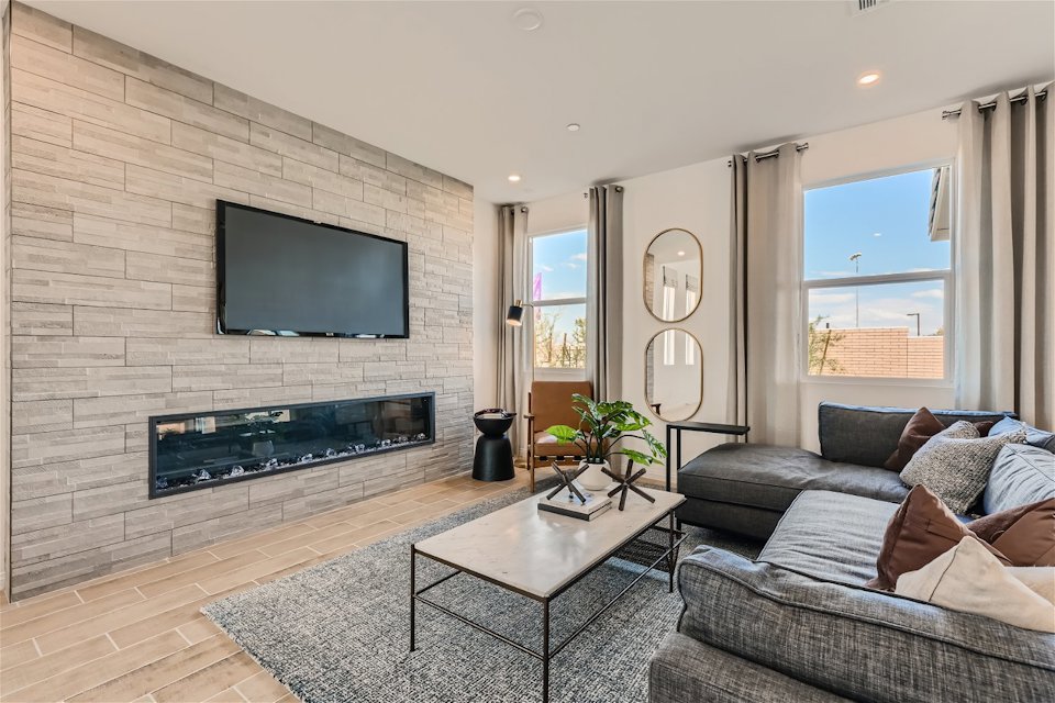 A living room with a fireplace.