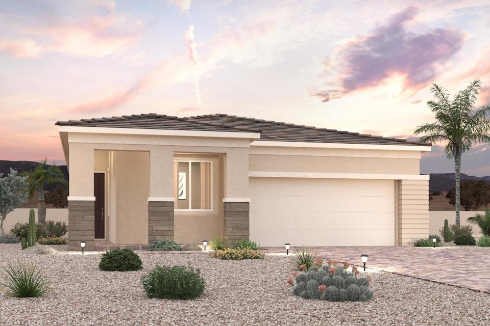 A house with a gravel driveway.