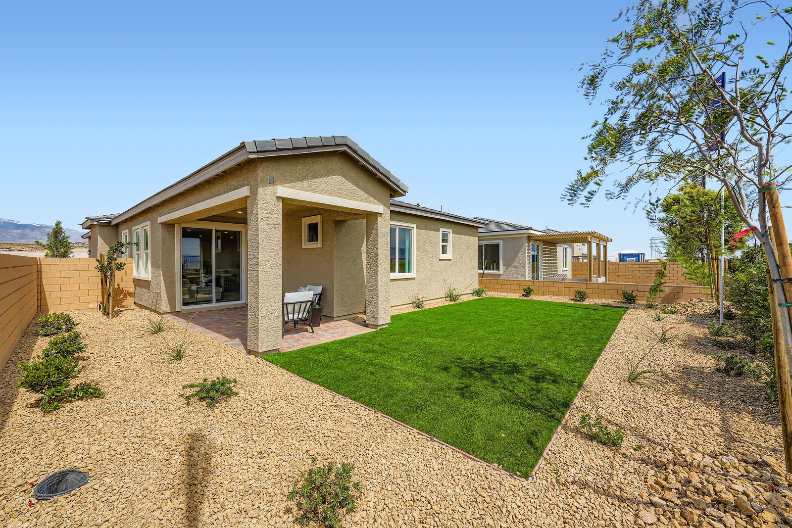 A house with a large front yard.