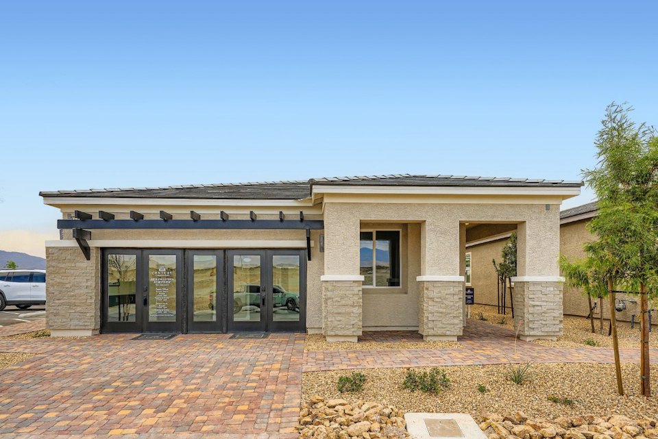 A building with a brick driveway.