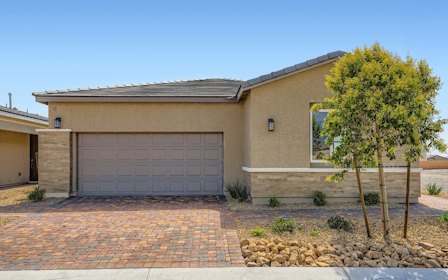 A building with a brick driveway.