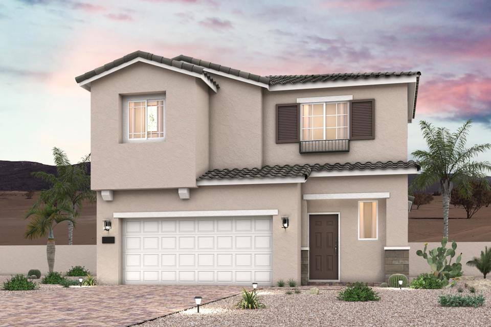 A house with a garage and trees.