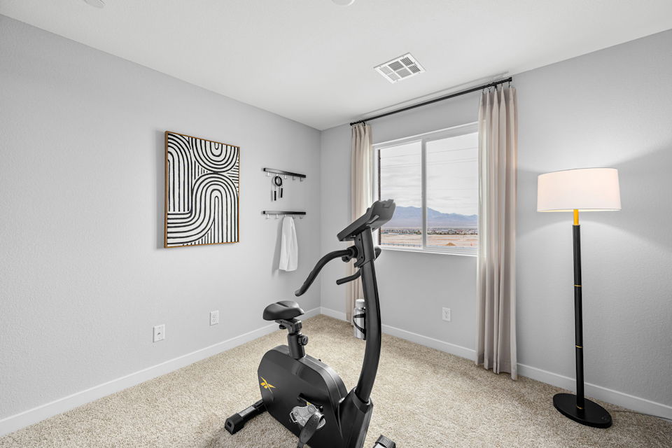 A room with a vacuum and a window.