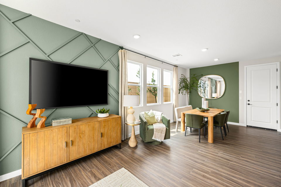 A living room with a tv and a table.