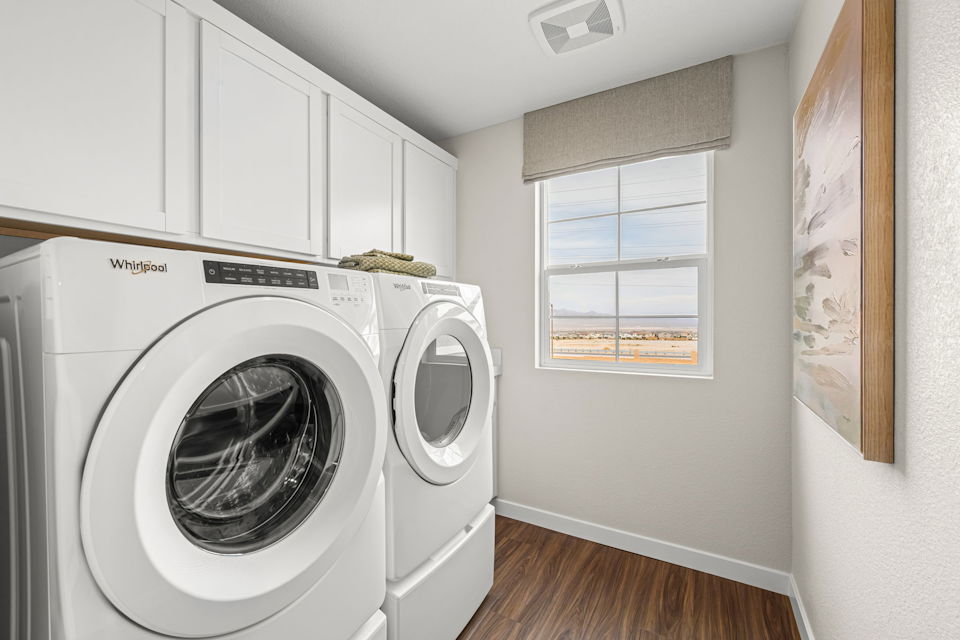A washing machine in a room.