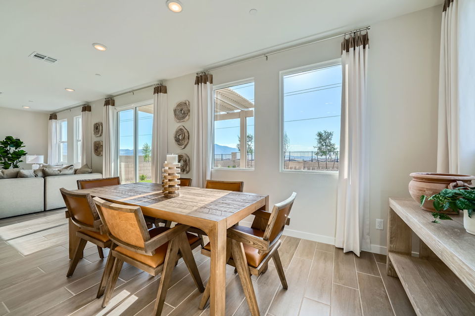 A dining room with a large window.