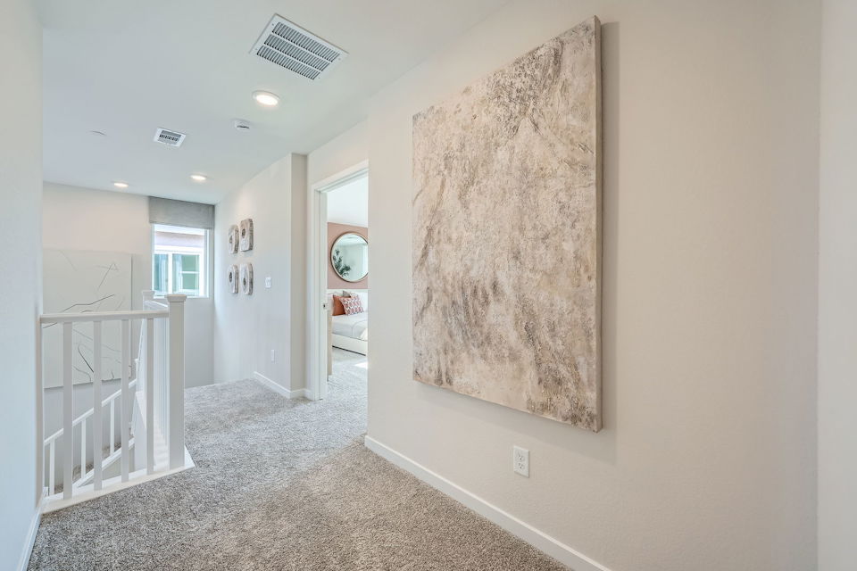 A room with a wall of art.