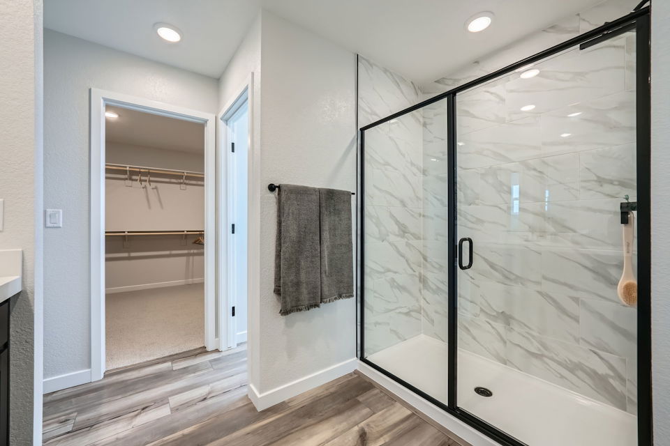 A bathroom with a glass shower.