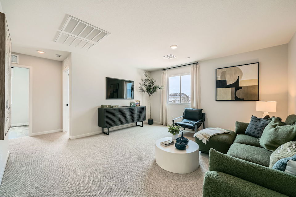 A living room with a couch and a coffee table.