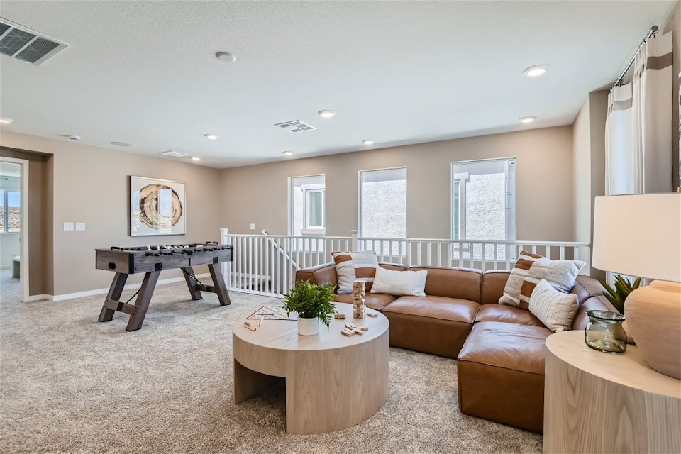 A living room with a couch and coffee table.