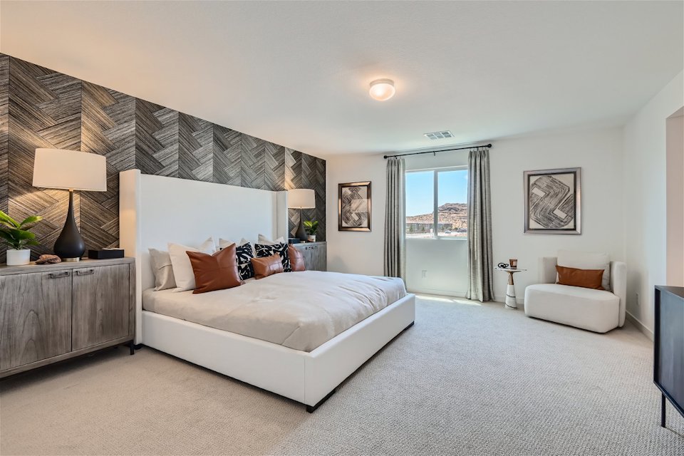 A bedroom with a large bed.