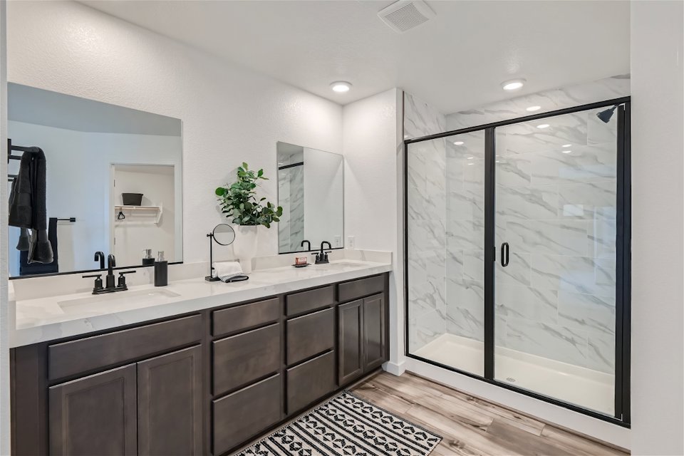 A bathroom with a glass shower.