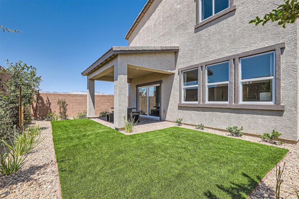 A house with a grass yard.