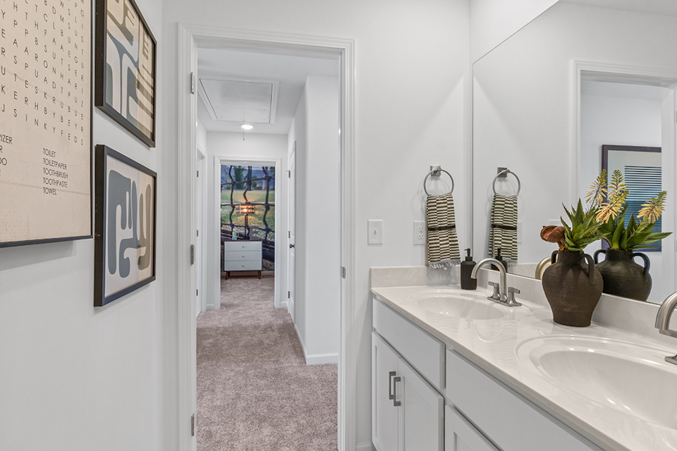 A bathroom with a sink and a mirror.