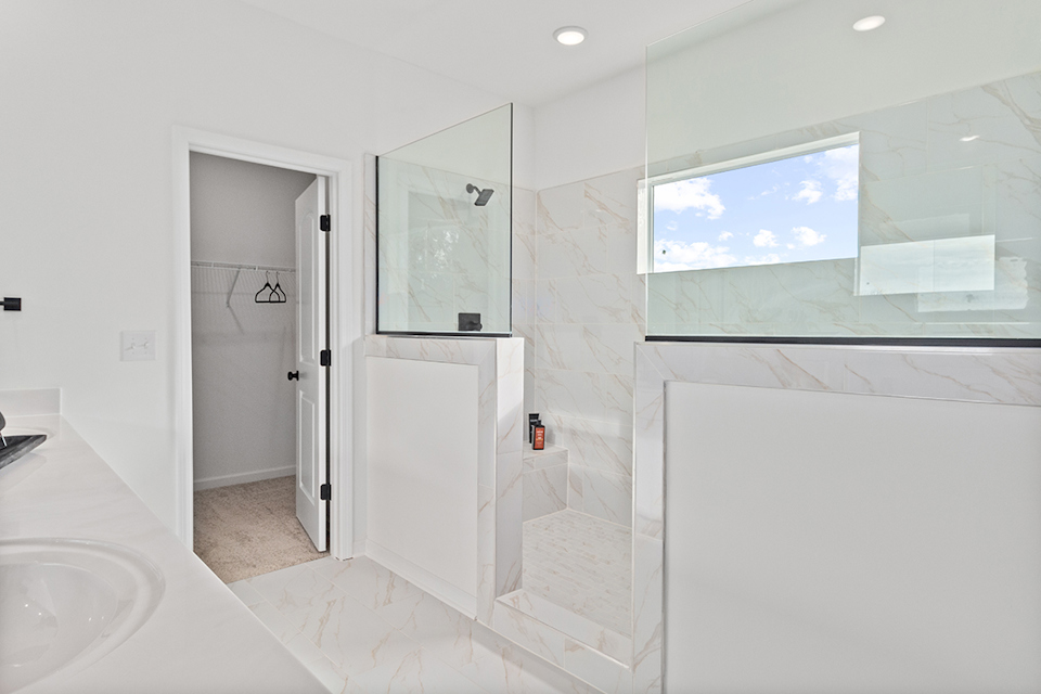 A bathroom with a glass shower.