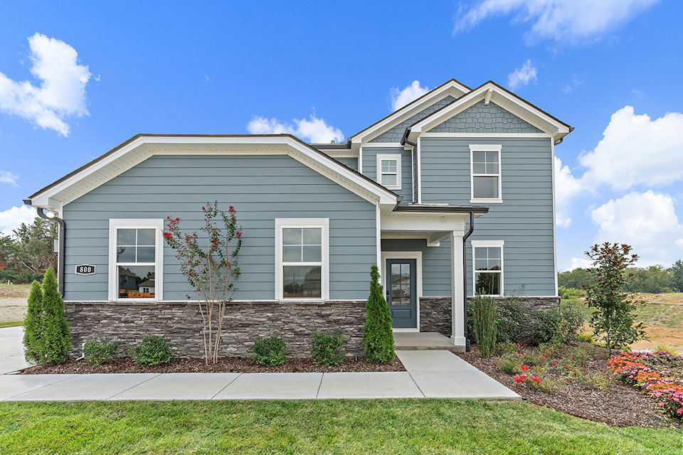 A house with a large front yard.