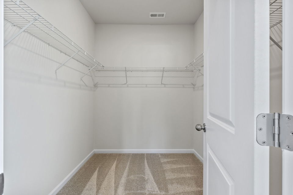 A shower with a tile floor.