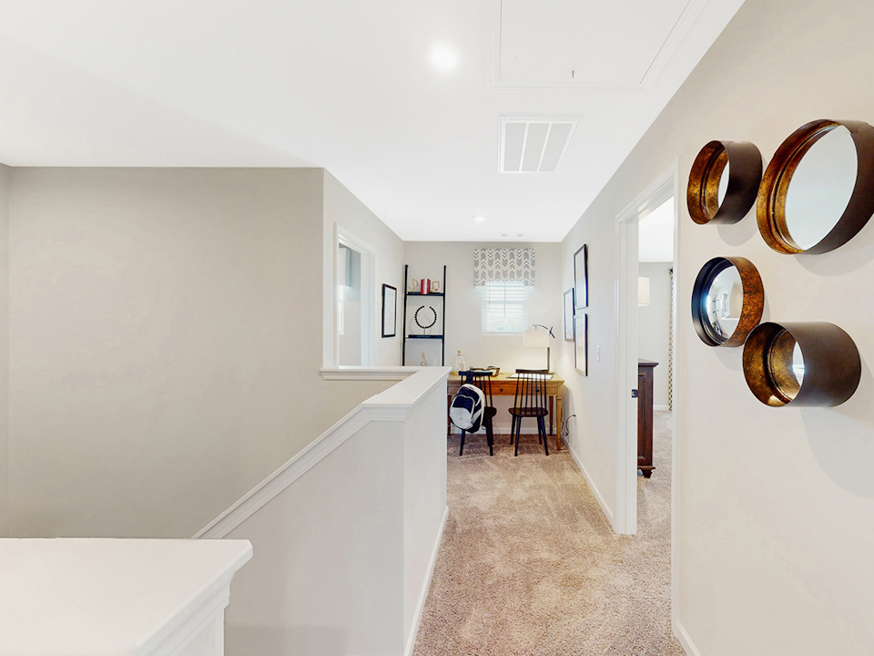 A room with a table and chairs.