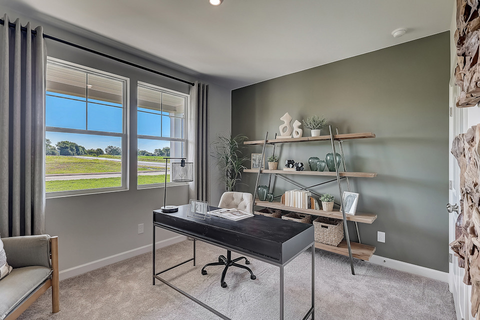 A room with a table and shelves.