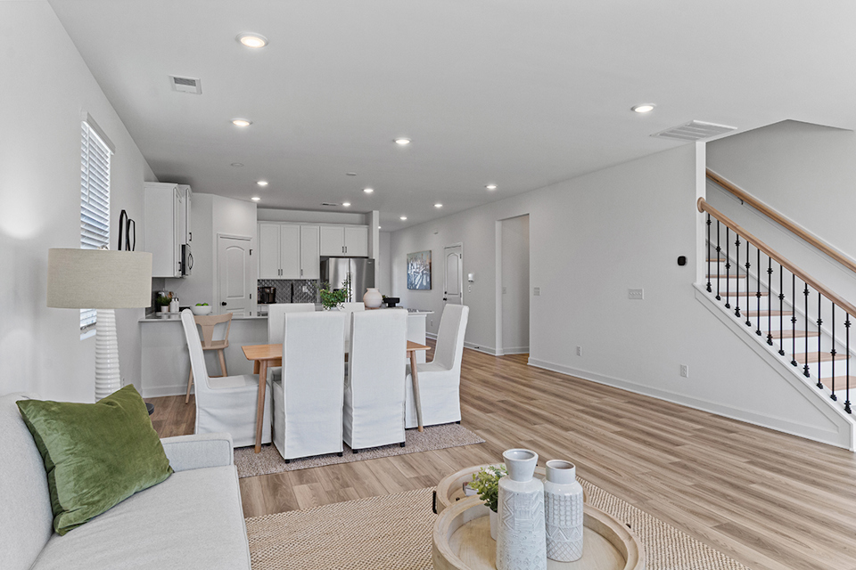 A large kitchen with a dining table.