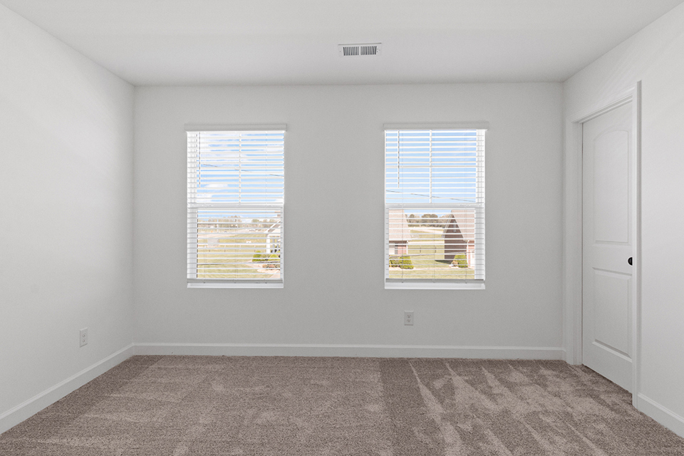 A room with a window and a door.