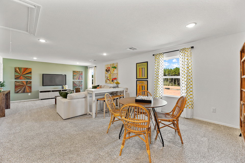 A living room with a couch and a table.