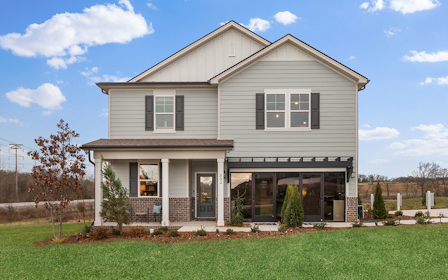 A house with a lawn in front.
