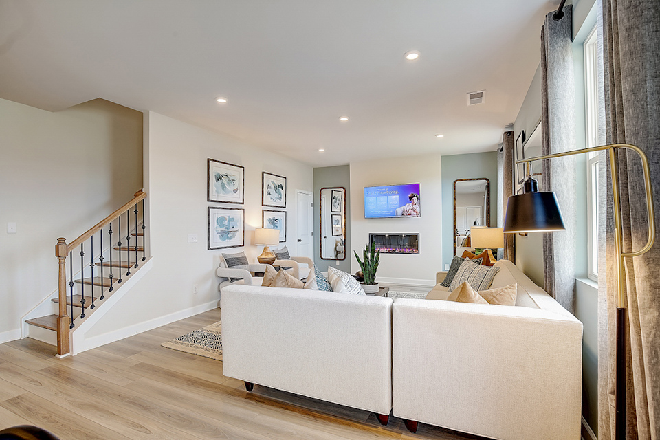 A living room with a white couch.