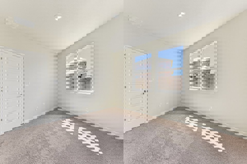 A room with a window and a door.