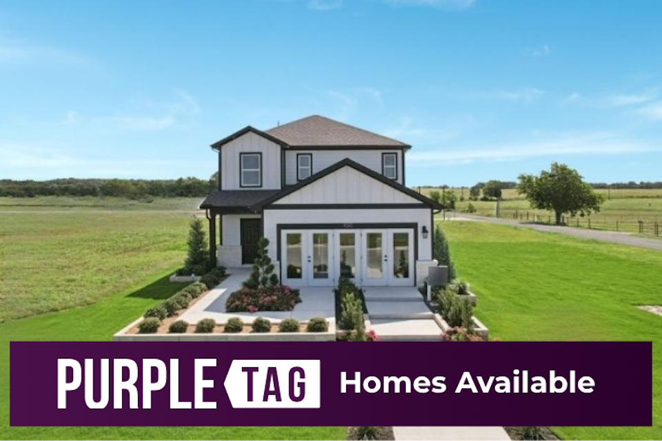 A house with a lawn and trees.