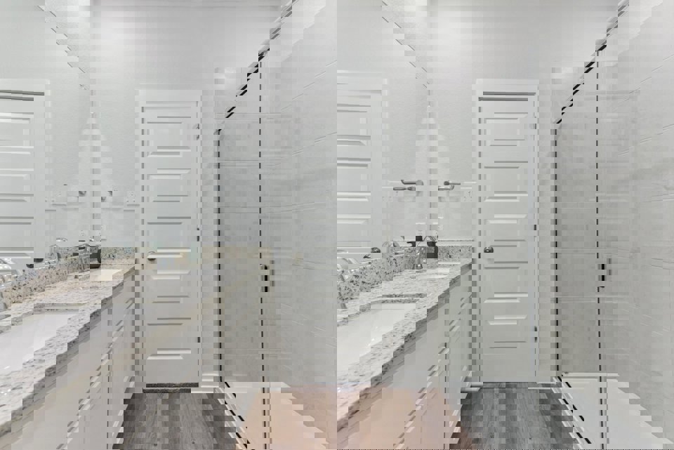 A bathroom with a glass shower.