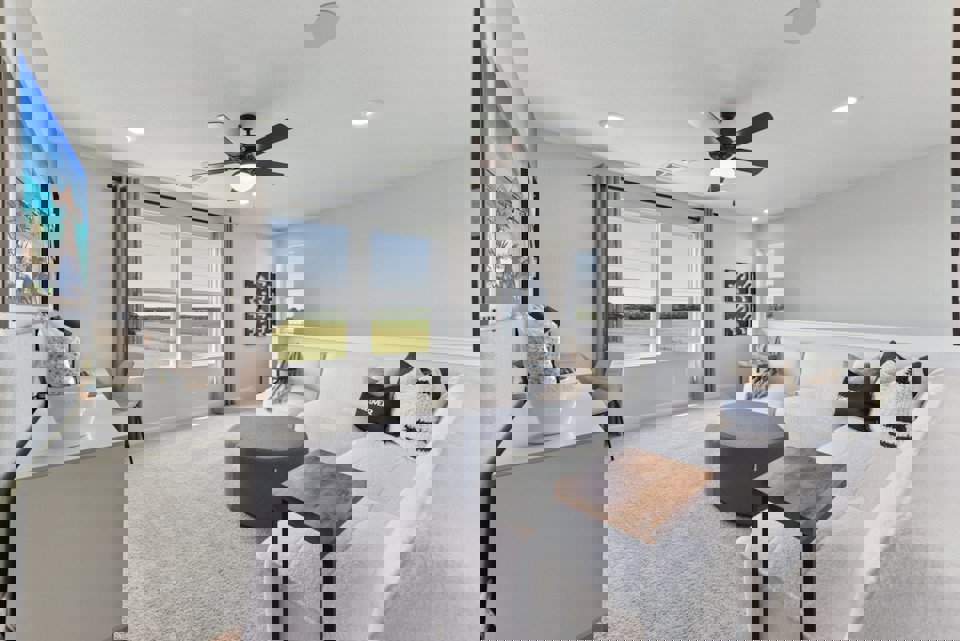 A living room with a couch and a table.