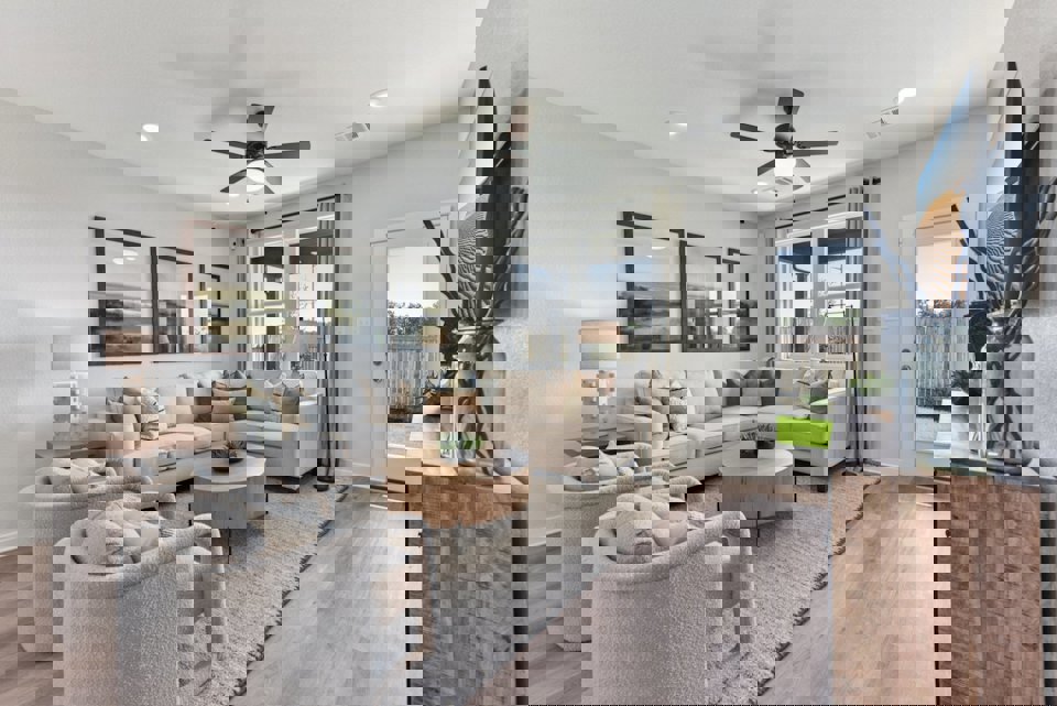 A living room with a large television and a couch.