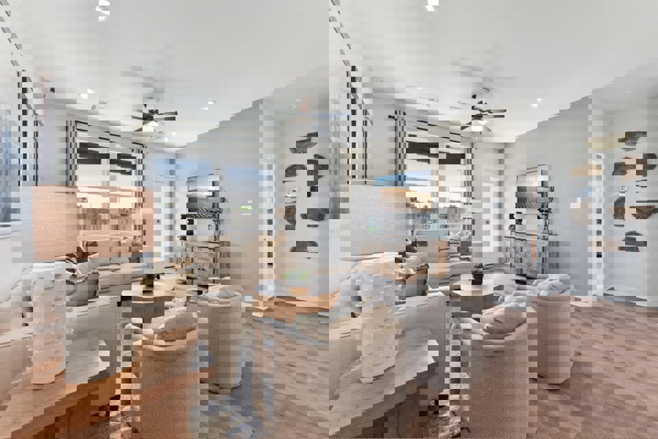 A living room with a wood floor.