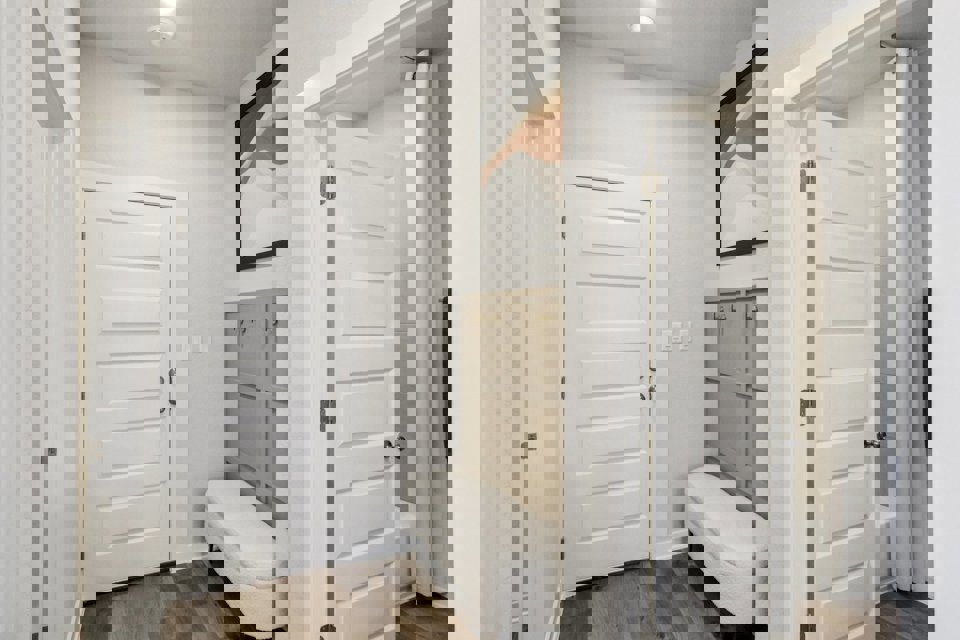 A bathroom with white doors.