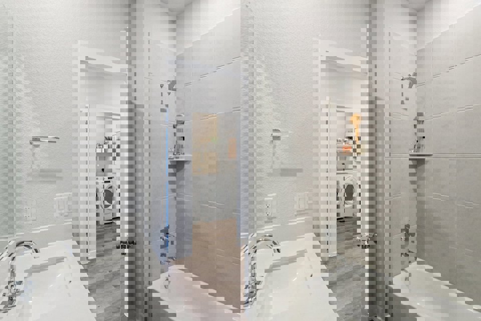 A bathroom with a sink and a bathtub.