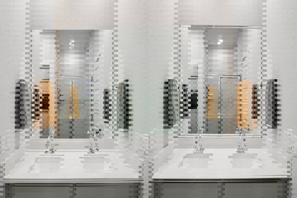 A bathroom with a glass shower.