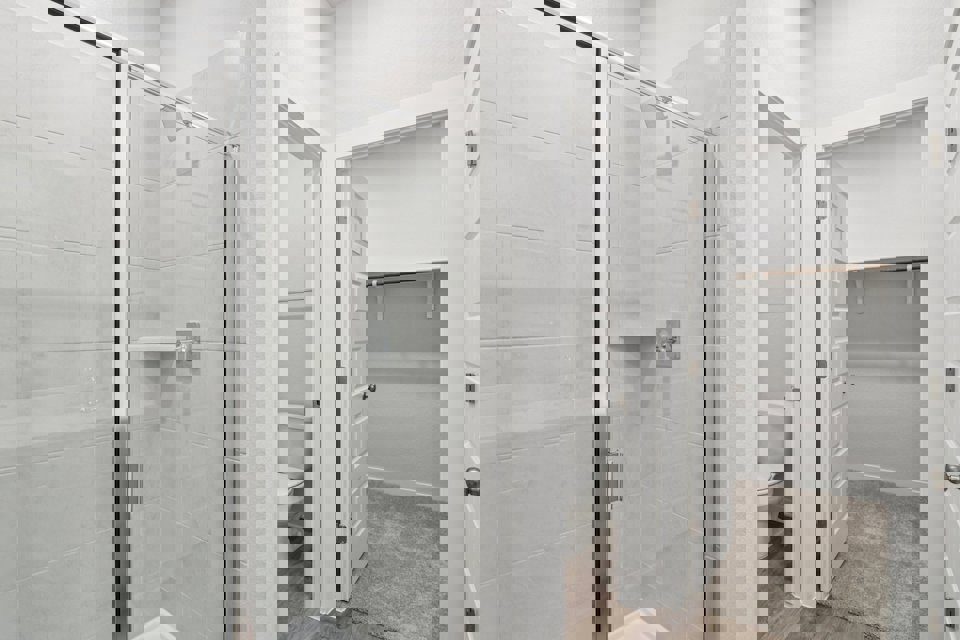 A bathroom with a glass shower.