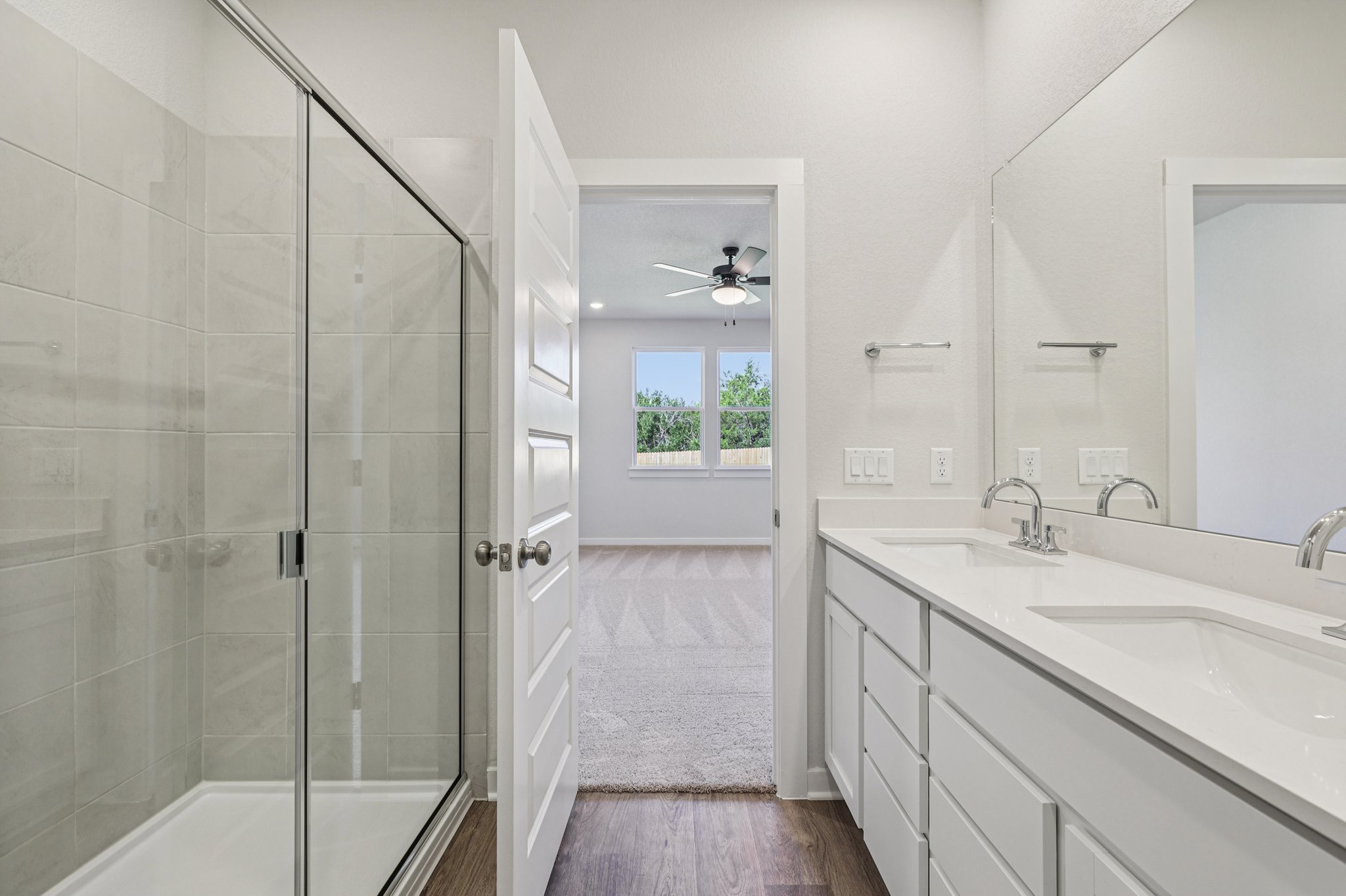 A bathroom with a glass shower.
