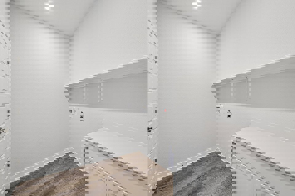 A white room with white cabinets.