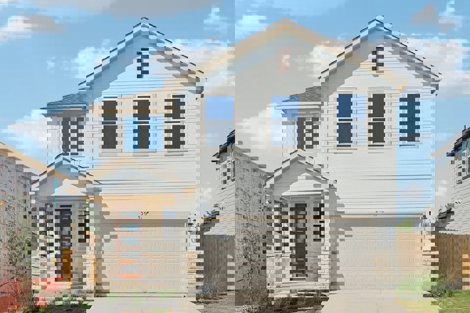 A white house with blue shutters.