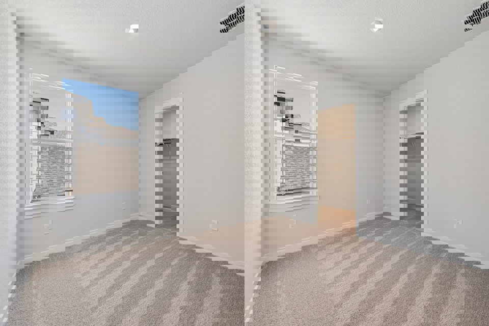 A room with a window and a door.