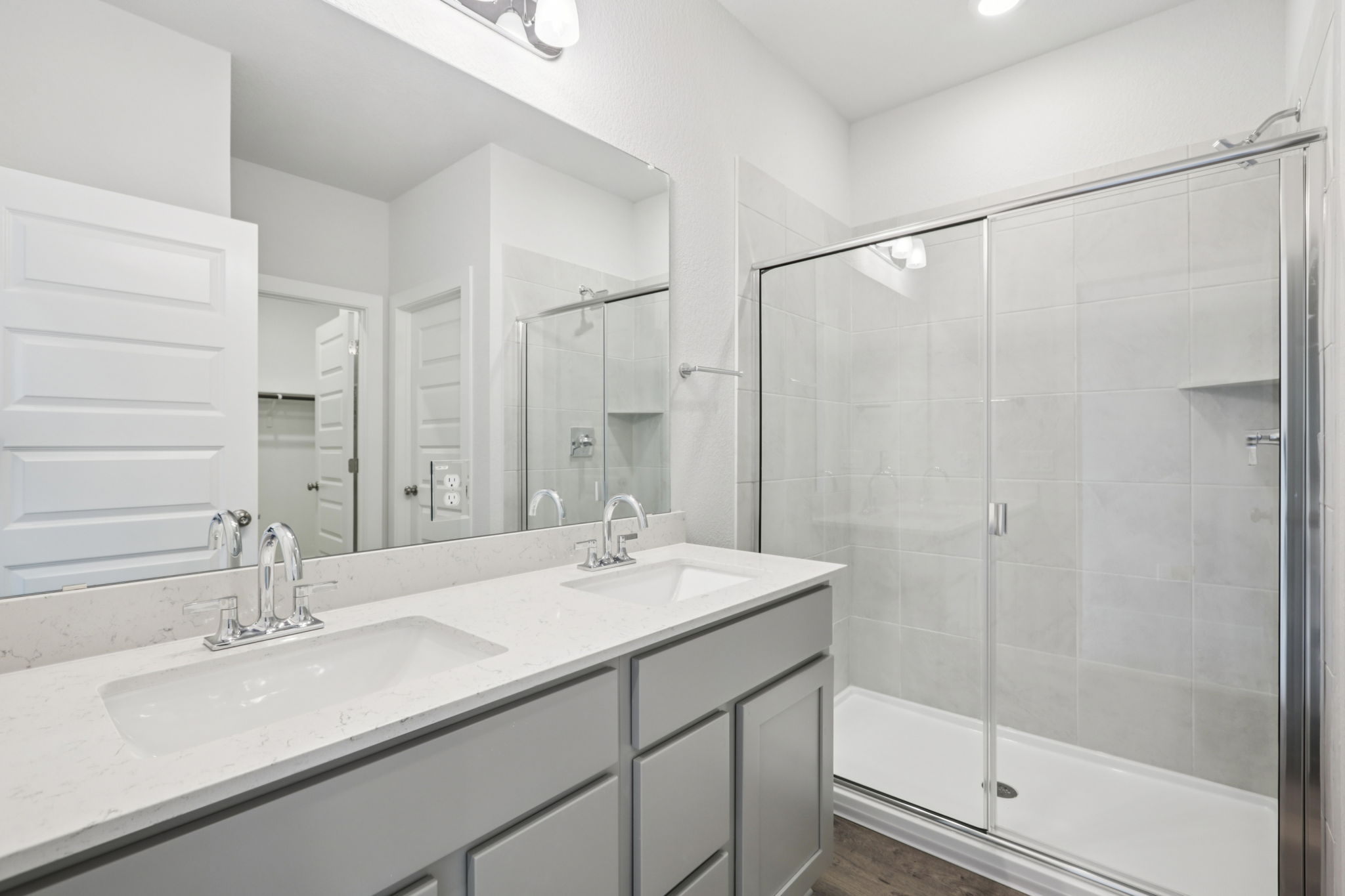 A bathroom with a glass shower.