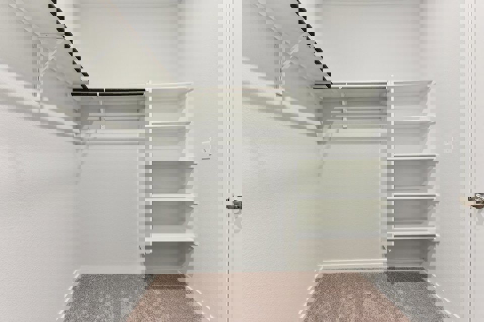 A white staircase in a room.