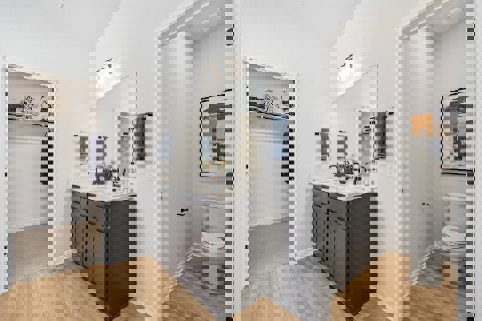 A bathroom with a toilet and sink.