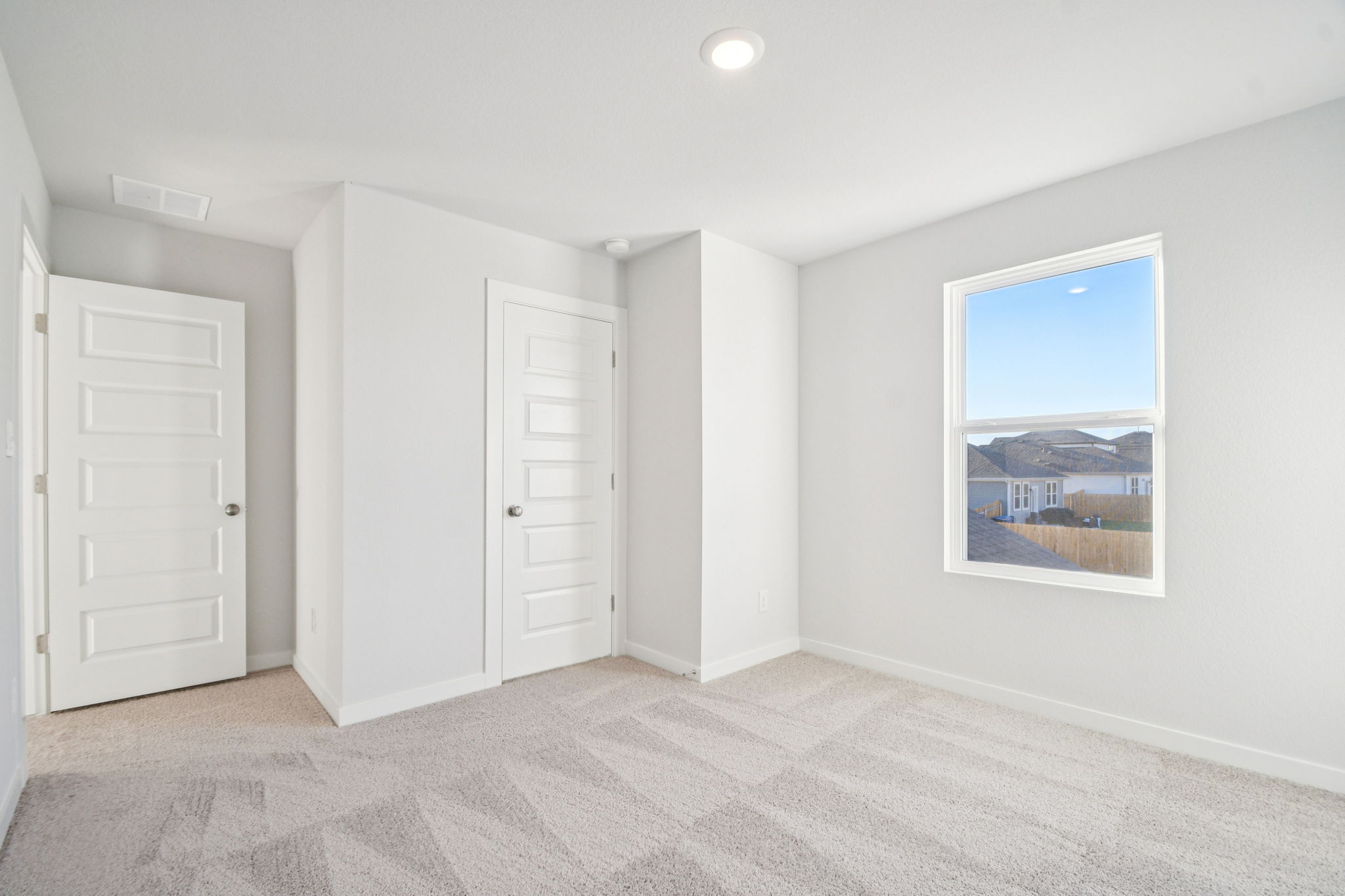 A room with white doors.