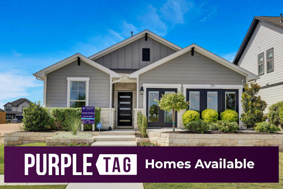 A house with a sign in front.